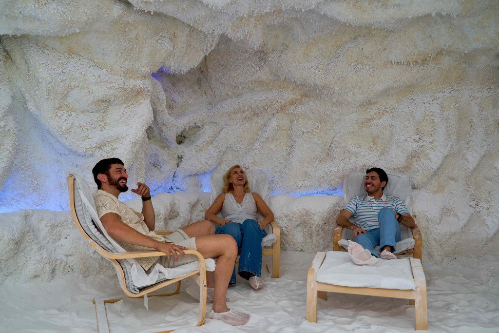 three-people-are-sitting-chairs-cavelike-room (1).jpg