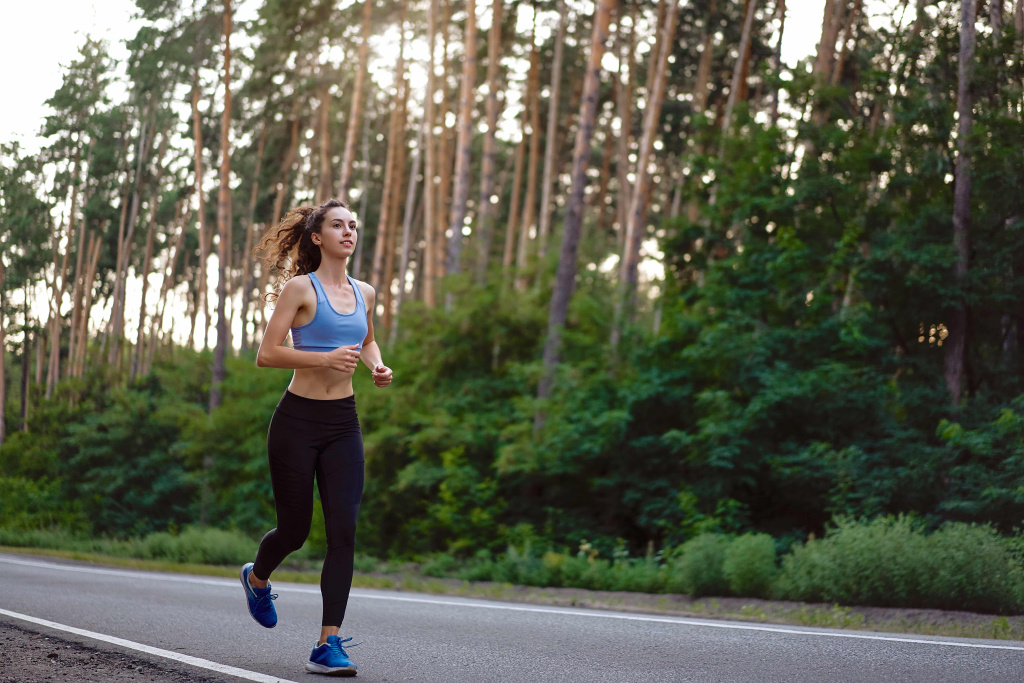 young-caucasian-woman-running-asphalt-road-sunny-summer-morning (1).jpg